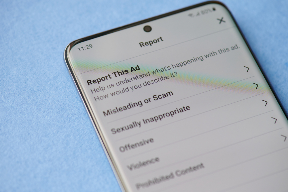 A function to report an ad on a social media app, appearing on a smartphone